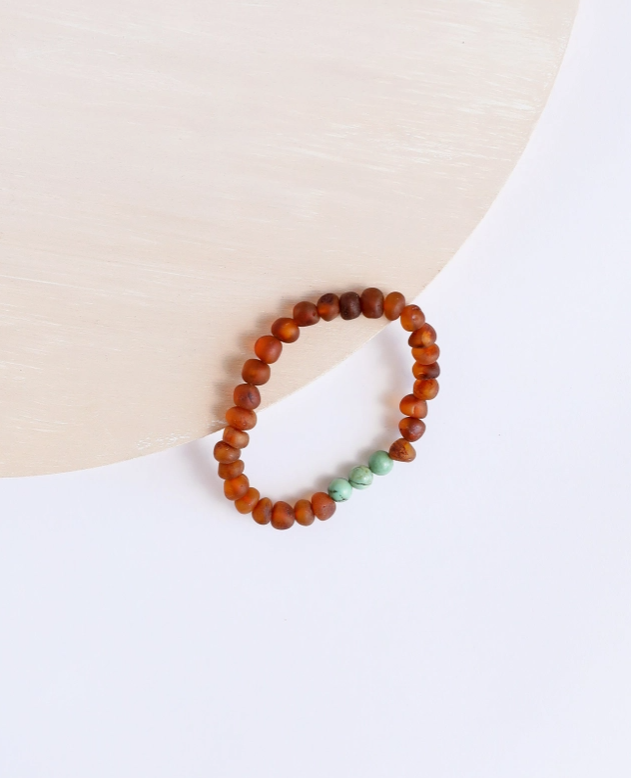 These Raw Cognac Baltic Amber + Turquoise Jasper || Bracley - Adult by Canyon Leaf are hand strung with amber beads that are smooth and round; on a clear gum elastic stretch cord so that the bracelet may be worn with ease. CanyonLeaf Baltic Sea Amber + Gemstone Jewelry is made for wearing, not for chewing.&nbsp;