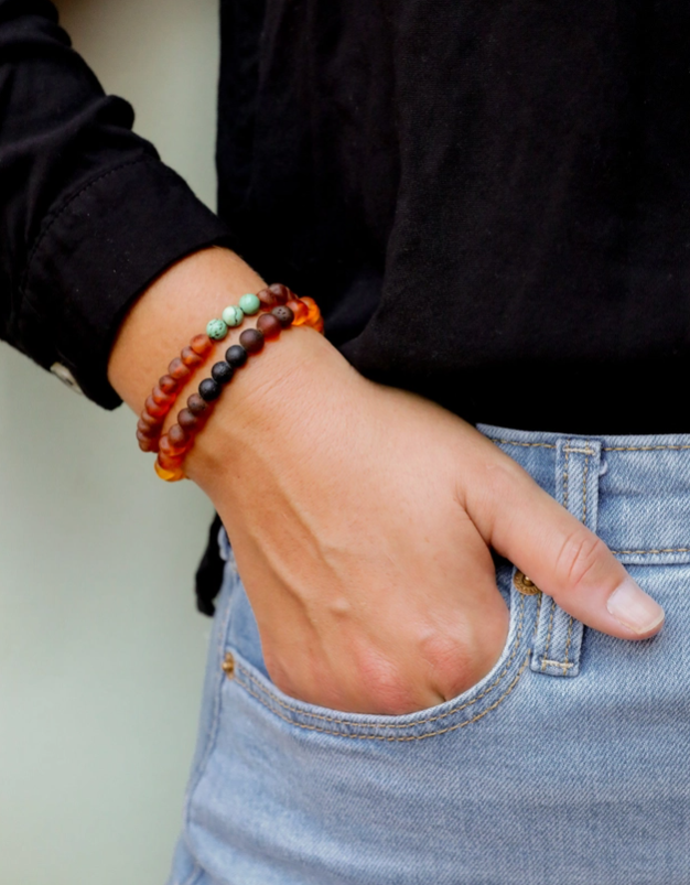 These Raw Cognac Baltic Amber + Turquoise Jasper || Bracley - Adult by Canyon Leaf are hand strung with amber beads that are smooth and round; on a clear gum elastic stretch cord so that the bracelet may be worn with ease. CanyonLeaf Baltic Sea Amber + Gemstone Jewelry is made for wearing, not for chewing.&nbsp;