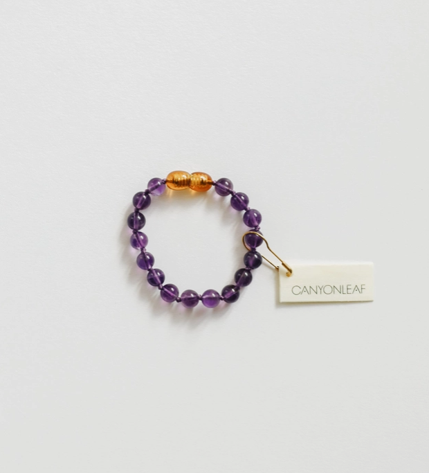 Wearing Mother Nature's Art is always in style, paired with the wonderful natural healing benefits of keeping gemstones close to our skin, we introduce Pure Gemstone + Amethyst || Beaded Anklet or Bracelet - Baby by CanyonLeaf. Each one carefully handspring and hand knotted between each bead, these simple little treasures are available in sizes for the whole family.
