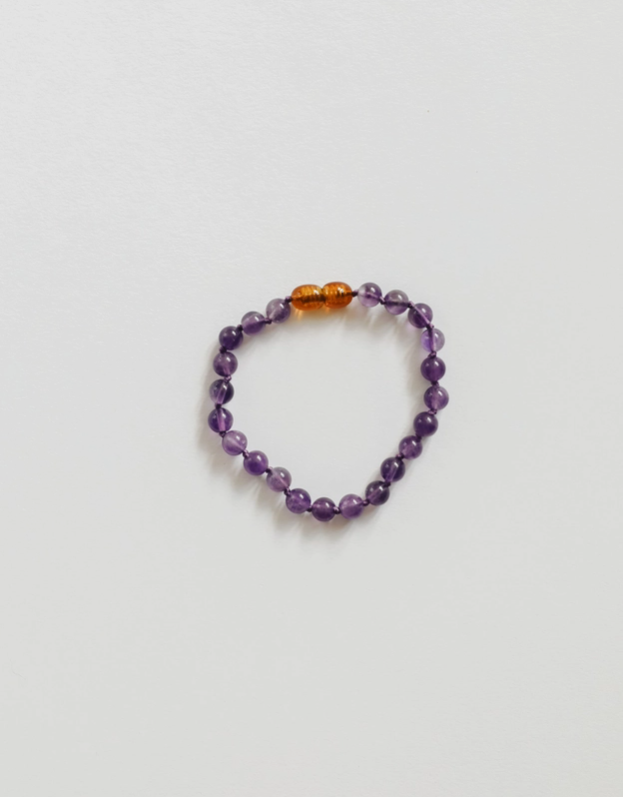 Wearing Mother Nature's Art is always in style, paired with the wonderful natural healing benefits of keeping gemstones close to our skin, we introduce Pure Gemstone + Amethyst || Beaded Anklet or Bracelet - Baby by CanyonLeaf. Each one carefully handspring and hand knotted between each bead, these simple little treasures are available in sizes for the whole family.