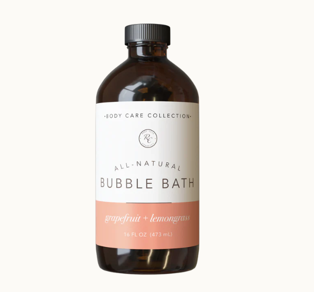 Unwind and relax with this luxurious Bubble Bath | 16 Oz - &nbsp;Grapefruit + Lemongrass by Rowe Casa that will leave your skin feeling moisturized and nourished. Our bubble baths are mild and gentle for all skin types. 100% pure, therapeutic grade essential oils offer the benefits of aromatherapy as you soak your stress away.